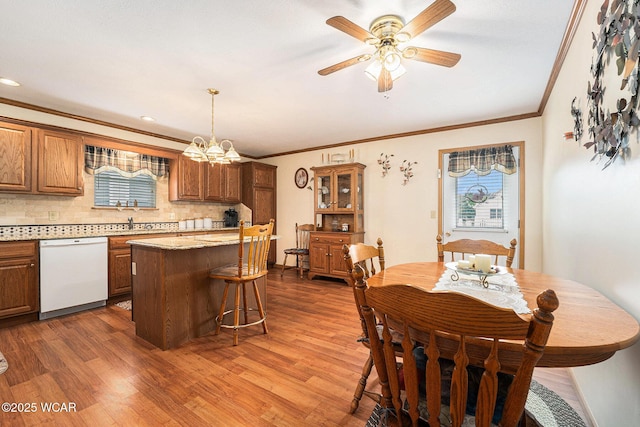 354 Stone Hedge Ln, Kenton, OH 43326 - dining area featuring crown molding, dark wood-type flooring, ceiling fan, and a chandelier