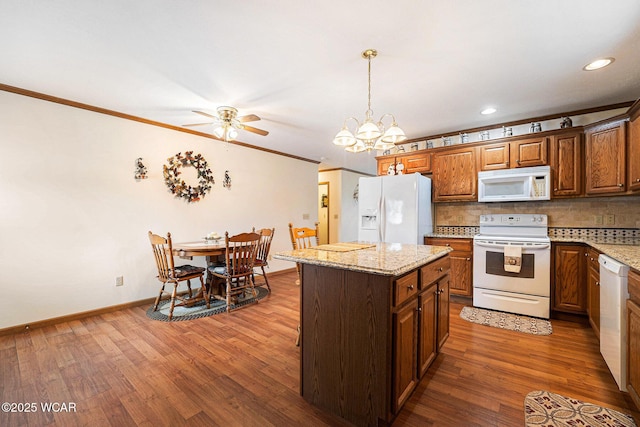 354 Stone Hedge Ln, Kenton, OH 43326 - kitchen with white appliances, ceiling fan, tasteful backsplash, a center island, and crown molding