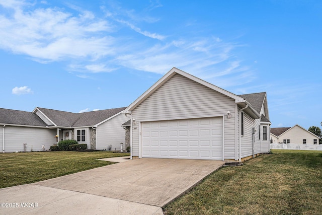 354 Stone Hedge Ln, Kenton, OH 43326 - ranch-style house featuring an attached garage, driveway, and a front lawn