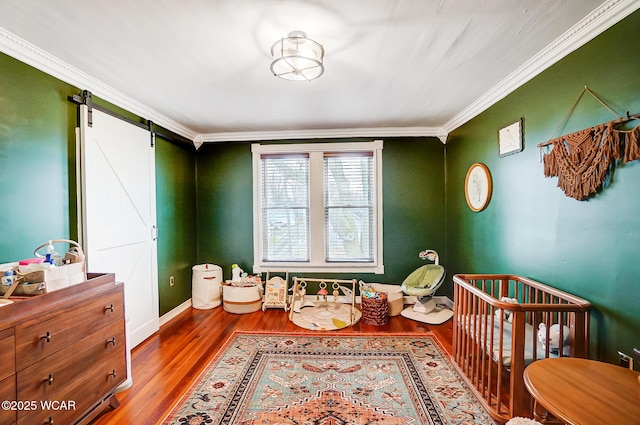 interior space featuring hardwood / wood-style flooring and ornamental molding