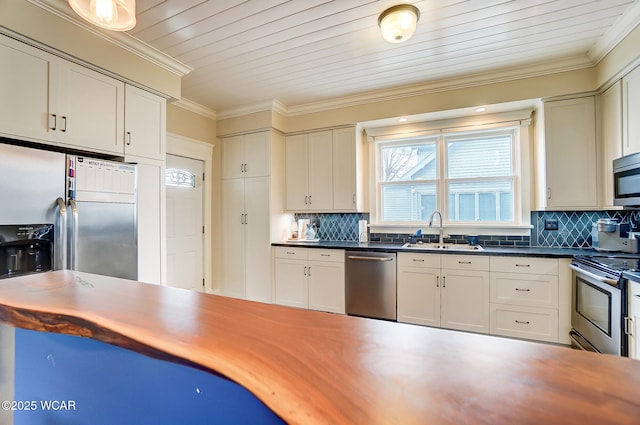 kitchen featuring sink, crown molding, stainless steel appliances, and backsplash