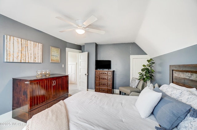 bedroom featuring ceiling fan and lofted ceiling