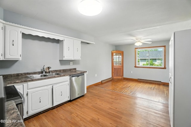 2170 E Hanthorn Rd, Lima, OH 45804 - kitchen featuring appliances with stainless steel finishes, ceiling fan, light wood-style floors, and dark countertops
