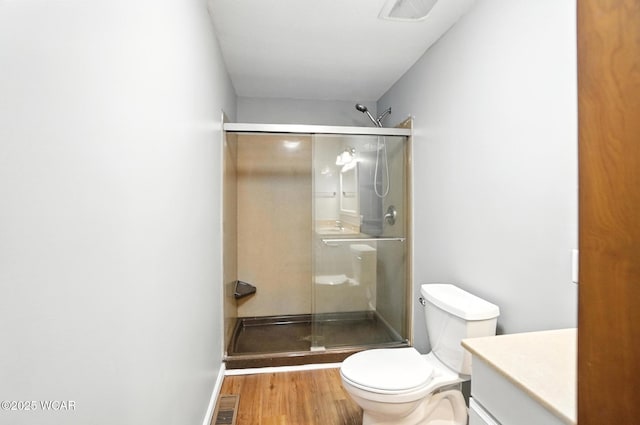 2170 E Hanthorn Rd, Lima, OH 45804 - bathroom featuring a shower stall, vanity, and wood finished floors