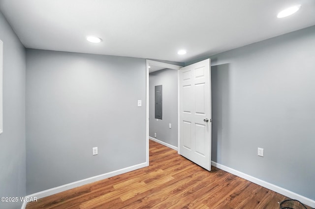 2170 E Hanthorn Rd, Lima, OH 45804 - empty room featuring electric panel, wood finished floors, and recessed lighting