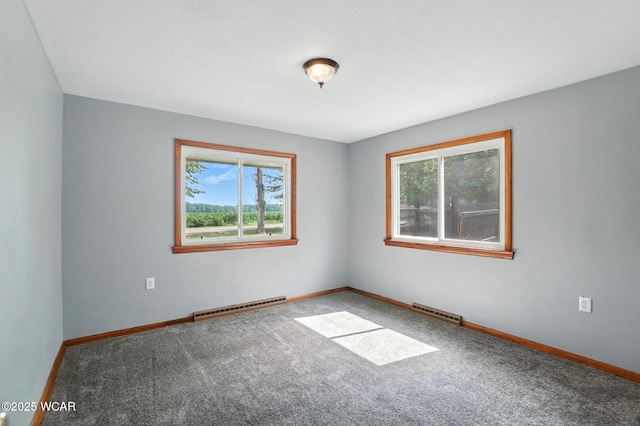 2170 E Hanthorn Rd, Lima, OH 45804 - spare room with a baseboard radiator, healthy amount of natural light, and carpet floors