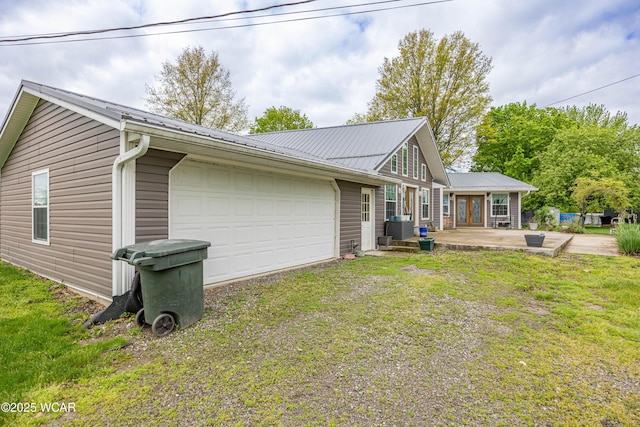 16949 Township Road 39, Belle Center, OH 43310 - back of property featuring metal roof, a lawn, and french doors