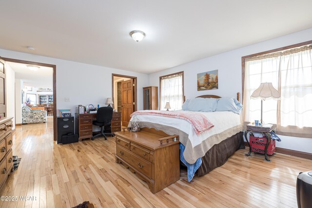 16949 Township Road 39, Belle Center, OH 43310 - bedroom with light wood finished floors and an office area