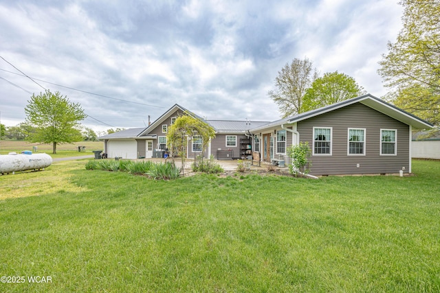 16949 Township Road 39, Belle Center, OH 43310 - ranch-style house with a patio and a front lawn