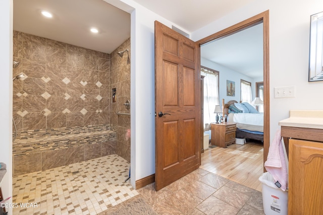 16949 Township Road 39, Belle Center, OH 43310 - ensuite bathroom featuring tiled shower, vanity, recessed lighting, and baseboards