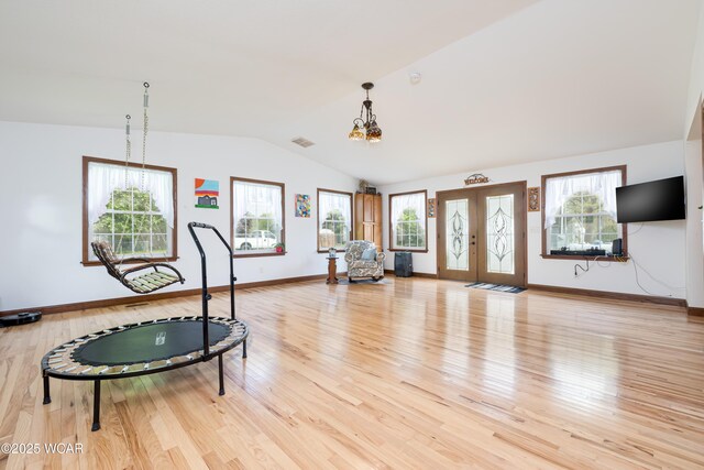 16949 Township Road 39, Belle Center, OH 43310 - playroom with vaulted ceiling, a chandelier, light wood-type flooring, plenty of natural light, and baseboards