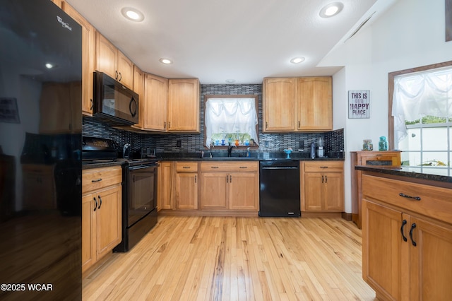 16949 Township Road 39, Belle Center, OH 43310 - kitchen featuring black appliances, plenty of natural light, light wood finished floors, backsplash, and recessed lighting
