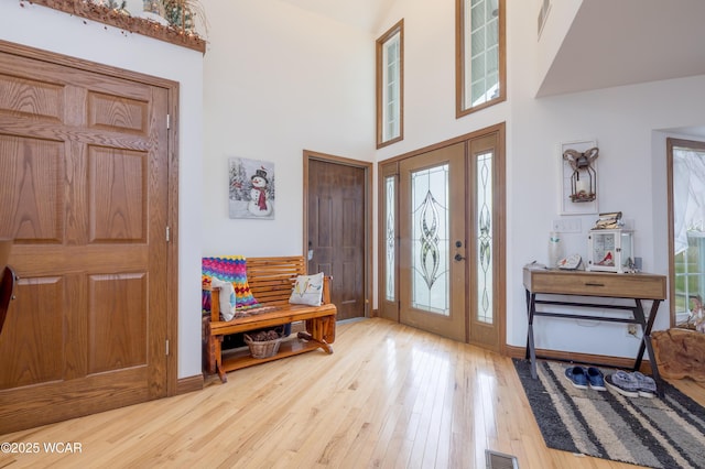 16949 Township Road 39, Belle Center, OH 43310 - entrance foyer with hardwood / wood-style floors, healthy amount of natural light, baseboards, and a towering ceiling