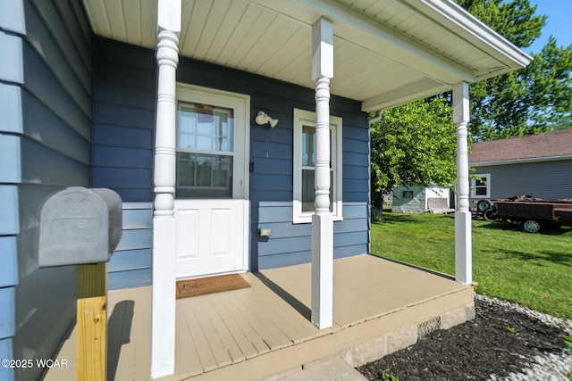 409 S Race St, Van Wert, OH 45891 - view of exterior entry featuring a porch and a lawn