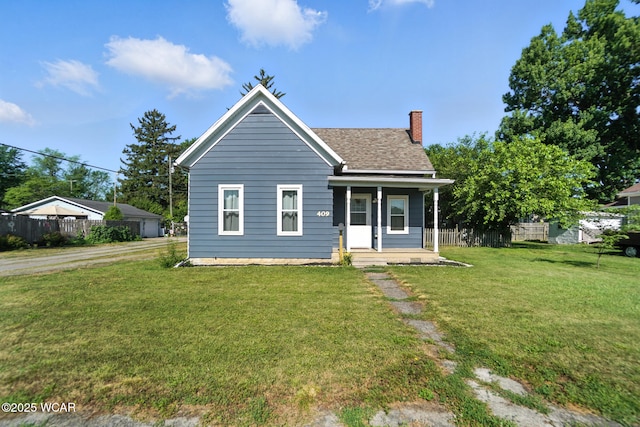 409 S Race St, Van Wert, OH 45891 - bungalow featuring covered porch, a chimney, and a shingled roof