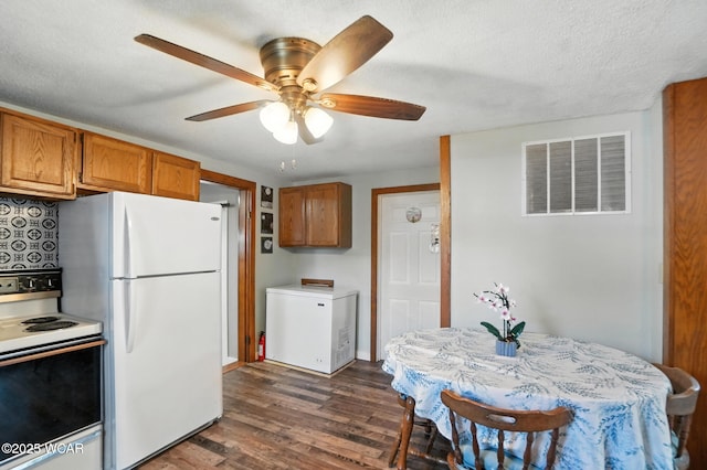 409 S Race St, Van Wert, OH 45891 - kitchen featuring white appliances, brown cabinets, dark wood finished floors, ceiling fan, and light countertops