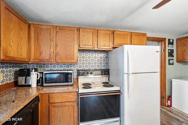 409 S Race St, Van Wert, OH 45891 - kitchen with white appliances, wood finished floors, brown cabinets, and a ceiling fan