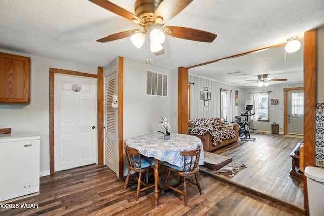 409 S Race St, Van Wert, OH 45891 - dining space with a ceiling fan, wood finished floors, and a textured ceiling
