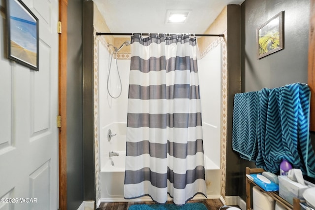 409 S Race St, Van Wert, OH 45891 - full bathroom featuring shower / tub combo with curtain and wood finished floors