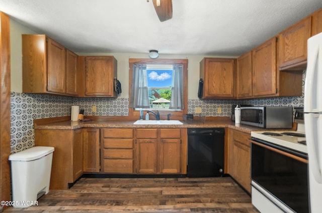409 S Race St, Van Wert, OH 45891 - kitchen featuring white appliances, dark wood-style flooring, and brown cabinetry