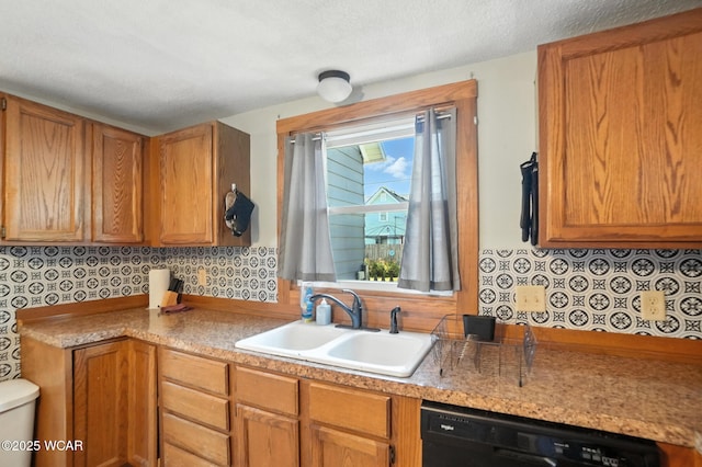 409 S Race St, Van Wert, OH 45891 - kitchen with dishwasher, light countertops, and brown cabinetry