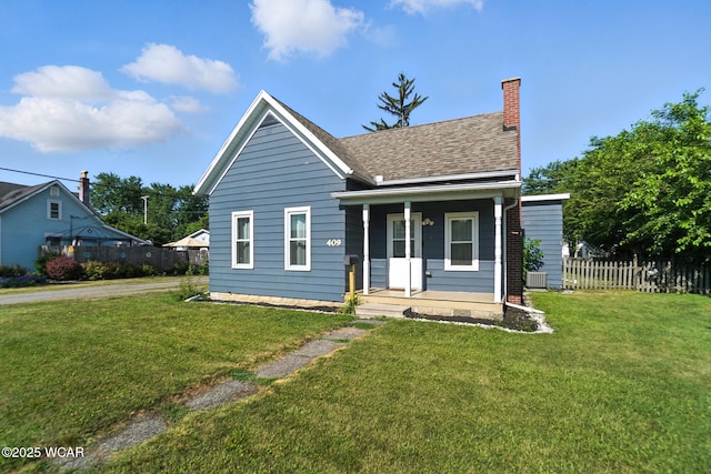 409 S Race St, Van Wert, OH 45891 - bungalow-style home with covered porch, a chimney, and a shingled roof