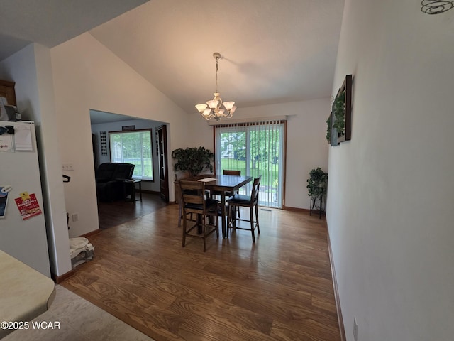 1919 Jared Pl, Lima, OH 45805 - dining room featuring a chandelier, lofted ceiling, wood finished floors, and baseboards
