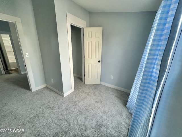 318 E E Vine St, Lima, OH 45804 - unfurnished bedroom featuring carpet flooring and baseboards