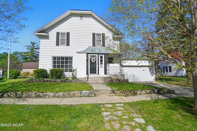 traditional-style home featuring driveway, metal roof, a front yard, and a garage