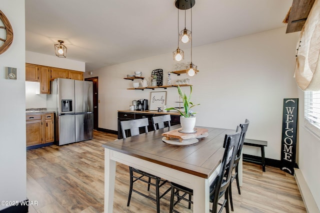 dining space featuring light hardwood / wood-style flooring