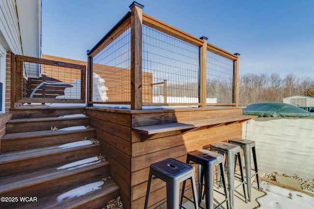 wooden deck with an outdoor bar