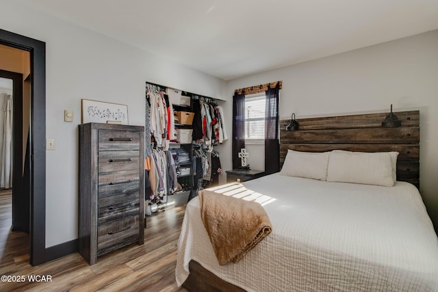 bedroom featuring hardwood / wood-style flooring