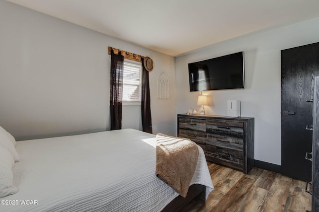 bedroom with wood-type flooring