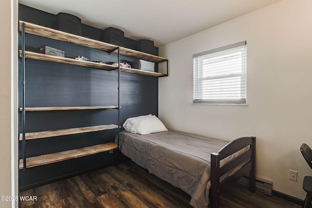 bedroom featuring dark hardwood / wood-style flooring