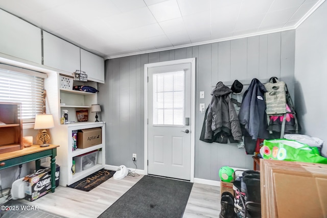 mudroom featuring ornamental molding and light hardwood / wood-style flooring