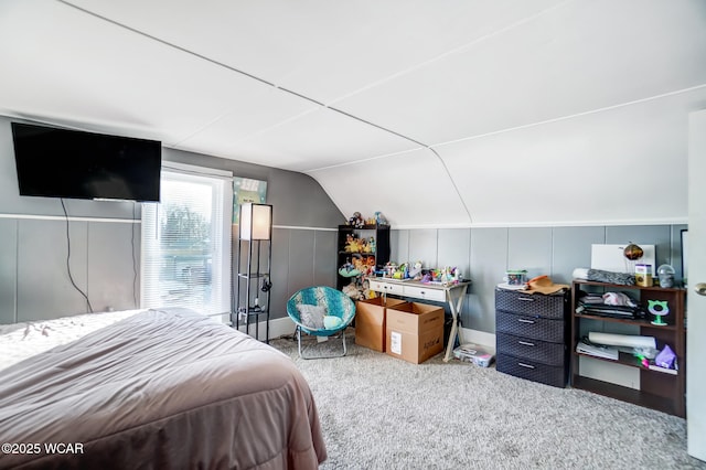 bedroom with lofted ceiling and carpet floors