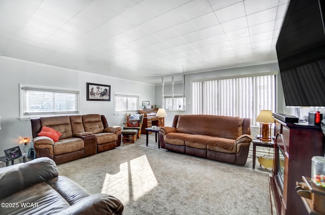 living room with light carpet and crown molding