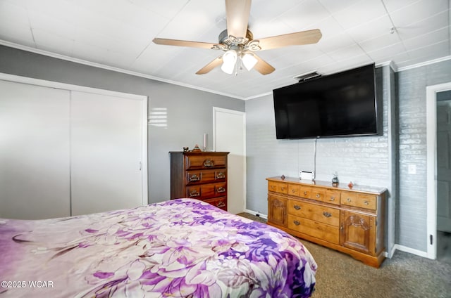 carpeted bedroom with crown molding, a closet, and ceiling fan