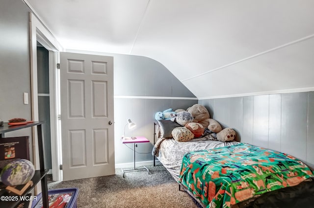 carpeted bedroom featuring vaulted ceiling