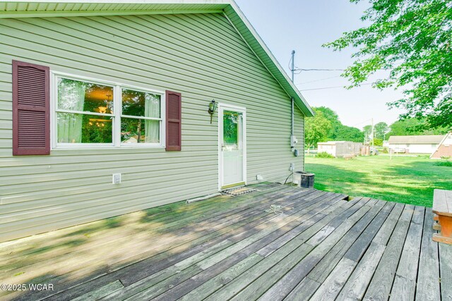 350 W Highland Ave, Ada, OH 45810 - wooden deck featuring a yard