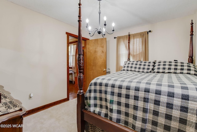 350 W Highland Ave, Ada, OH 45810 - bedroom featuring a chandelier and light carpet