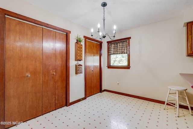 350 W Highland Ave, Ada, OH 45810 - unfurnished dining area featuring a chandelier and light floors