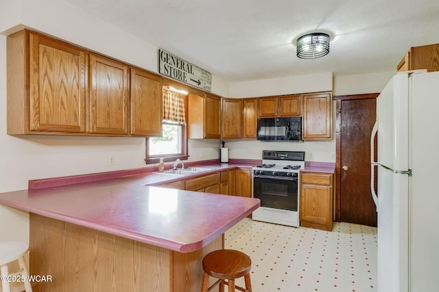 350 W Highland Ave, Ada, OH 45810 - kitchen with white appliances, a peninsula, brown cabinets, a kitchen bar, and light floors