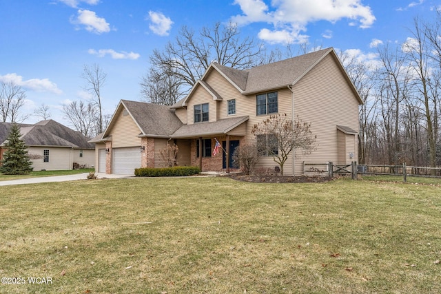 view of front property featuring a garage and a front yard