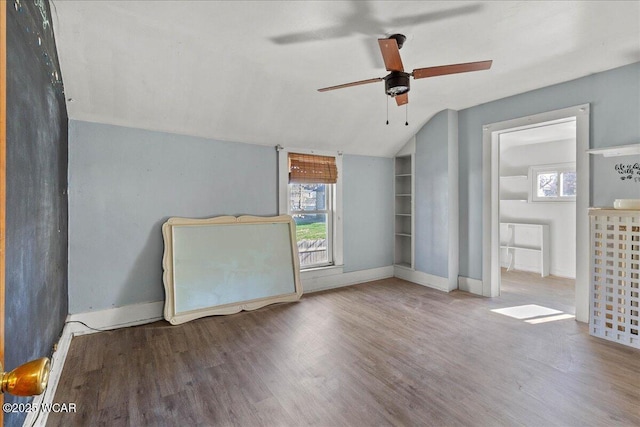 424 N Market St, Kenton, OH 43326 - unfurnished bedroom featuring lofted ceiling, wood finished floors, and baseboards