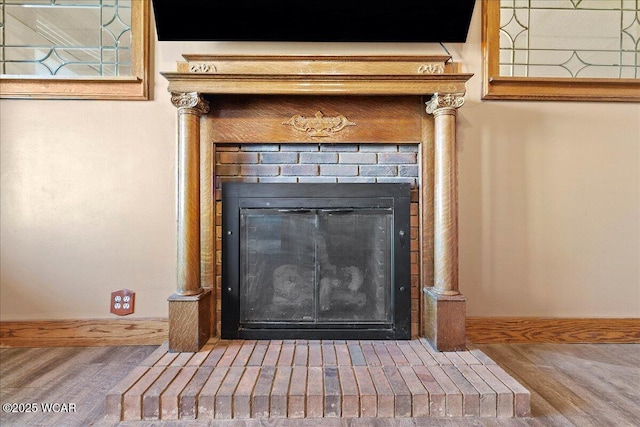 424 N Market St, Kenton, OH 43326 - room details with a fireplace, wood finished floors, and baseboards