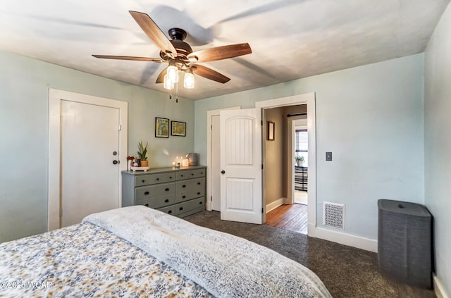 carpeted bedroom featuring ceiling fan