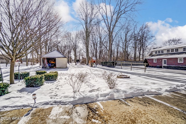 snowy yard with an outdoor structure