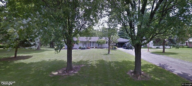 ranch-style house with a front lawn