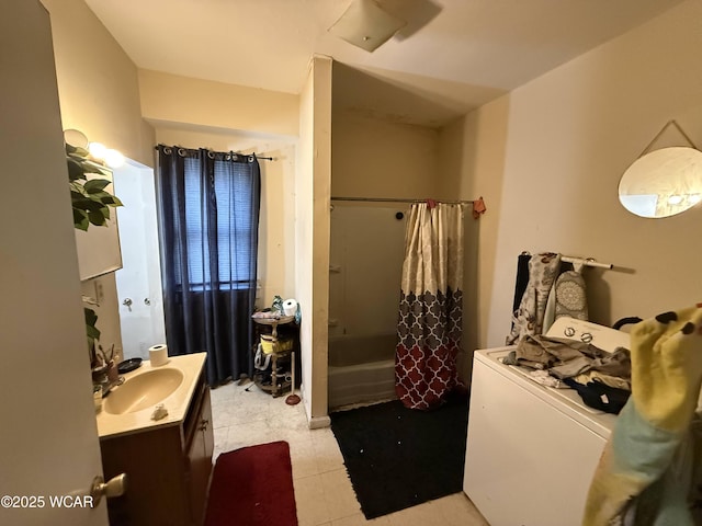 bathroom with vanity, washer / dryer, and shower / bath combination with curtain